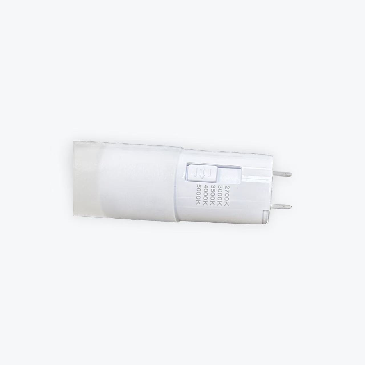 WechatIMG2923 A small, cylindrical 4FT LED T8 Tube Type C featuring a two-pin base. It is partially transparent and marked with color temperature settings from 2700K to 6500K, selectable via a side switch, and includes an emergency battery backup.